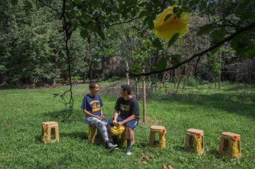 Elizabeth Soto and her boyfriend, Dawris Batista, at Bronx Park after they picked up trash to prepare for hosting a baby shower. (Sarah Stacke for The New York Times