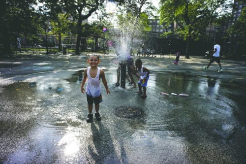 How to stay cool in the summer? Run through a fountain, especially if you're a kid. Photo: East River Park by Sue Brisk.